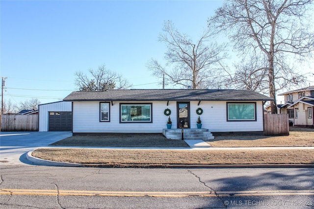 single story home featuring a garage