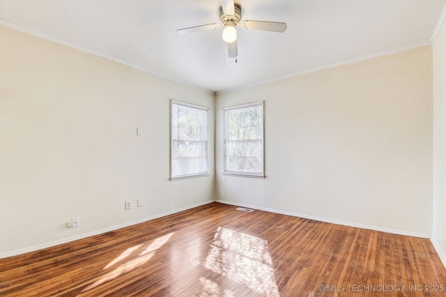 unfurnished room featuring hardwood / wood-style flooring, ceiling fan, and crown molding