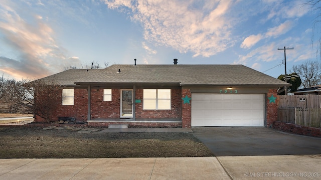 ranch-style house featuring a garage