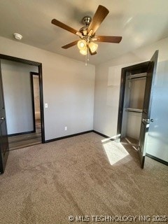 unfurnished bedroom featuring vaulted ceiling, ceiling fan, and carpet flooring