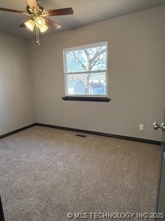 empty room with carpet flooring and ceiling fan