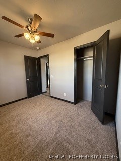 unfurnished bedroom featuring light carpet, a closet, and ceiling fan