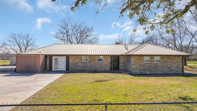 single story home featuring a front lawn and french doors