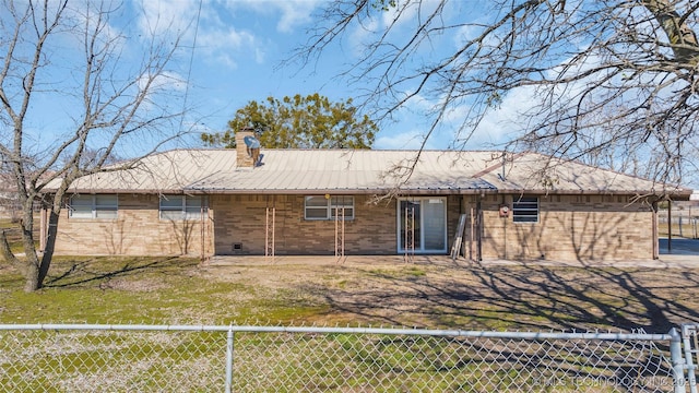 back of house with a lawn