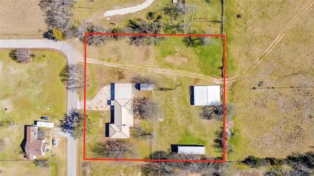 birds eye view of property featuring a rural view