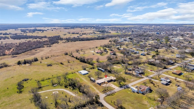 birds eye view of property with a rural view