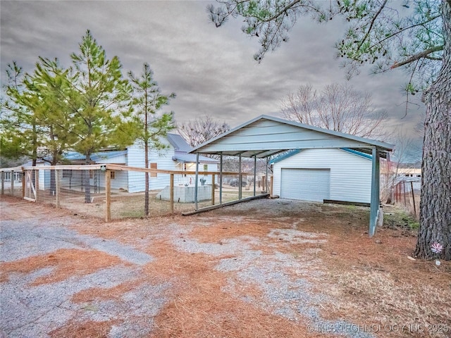 garage featuring a carport