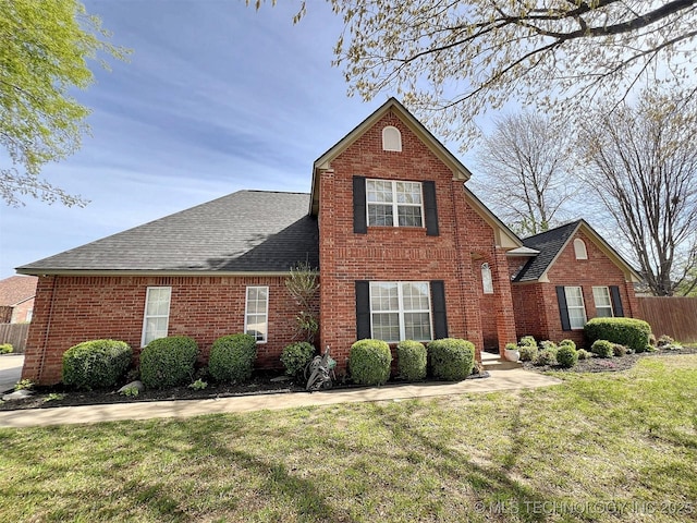 front facade with a front yard