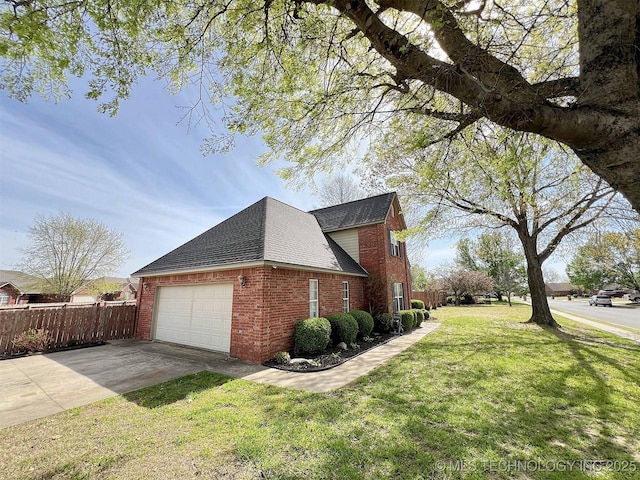 view of side of property with a garage and a lawn