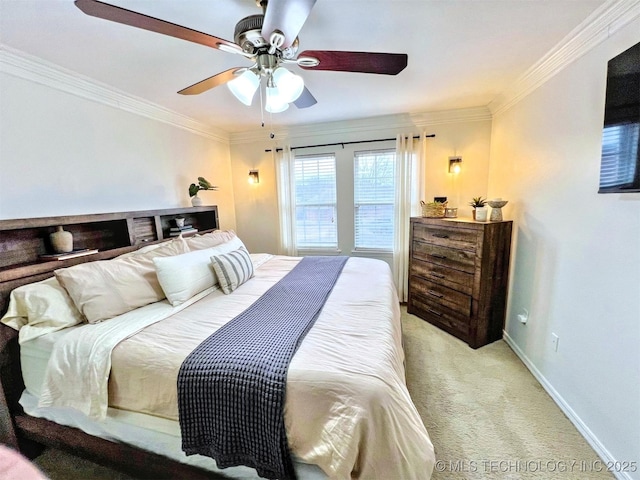 carpeted bedroom with crown molding and ceiling fan