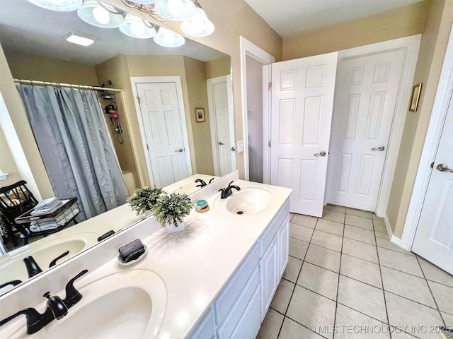 bathroom featuring vanity, shower / bath combo, and tile patterned floors