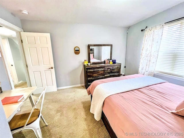 bedroom featuring light colored carpet