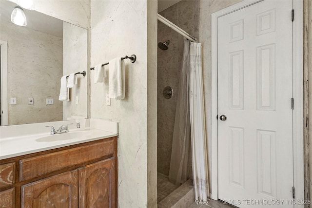 bathroom with vanity and a shower with shower curtain