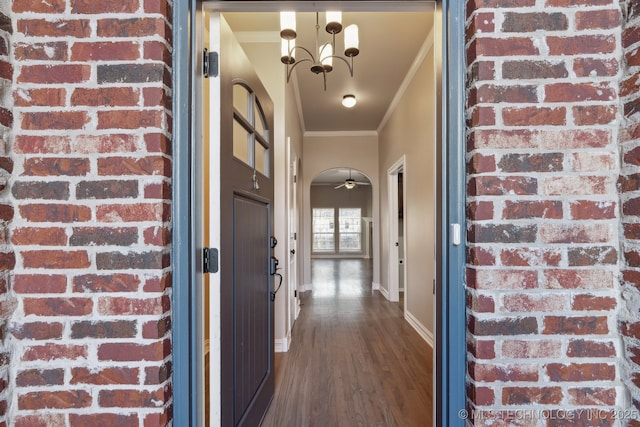 hallway with a chandelier