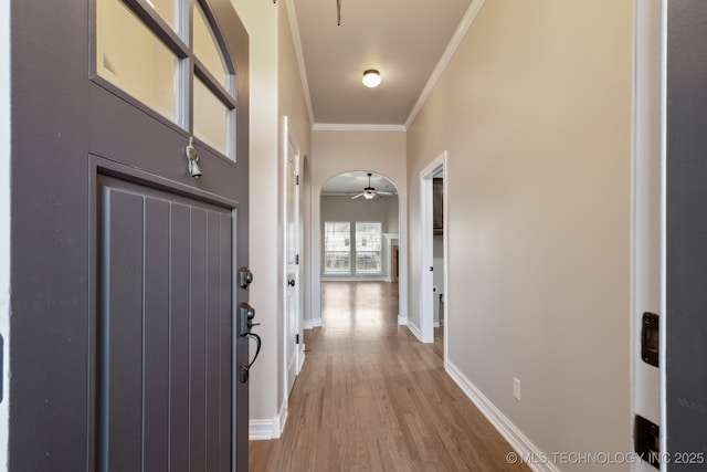 corridor featuring ornamental molding and hardwood / wood-style floors