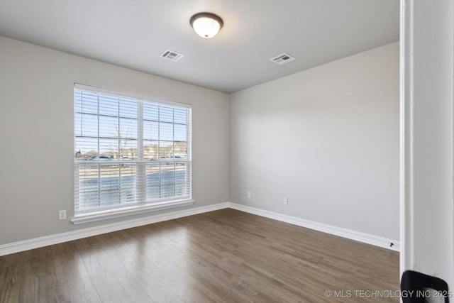 empty room featuring dark hardwood / wood-style floors