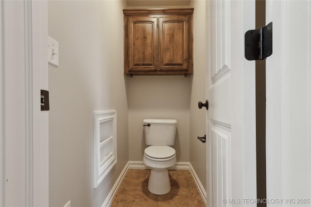 bathroom with tile patterned floors and toilet