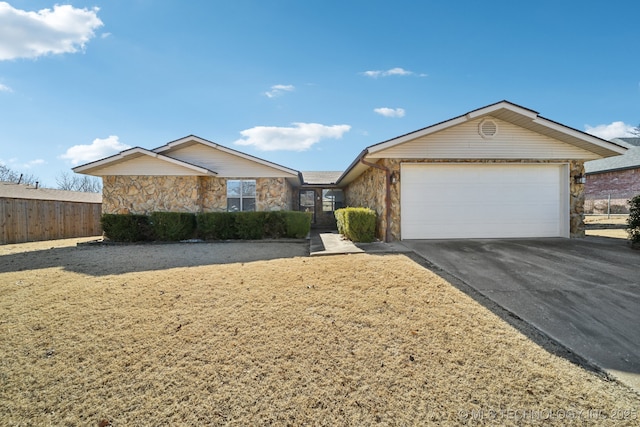 ranch-style house featuring a garage