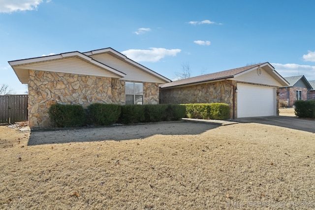 single story home featuring a garage