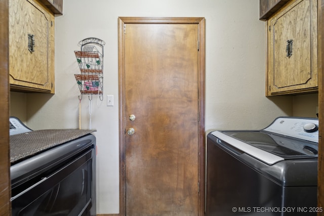 laundry area with cabinets and washing machine and clothes dryer