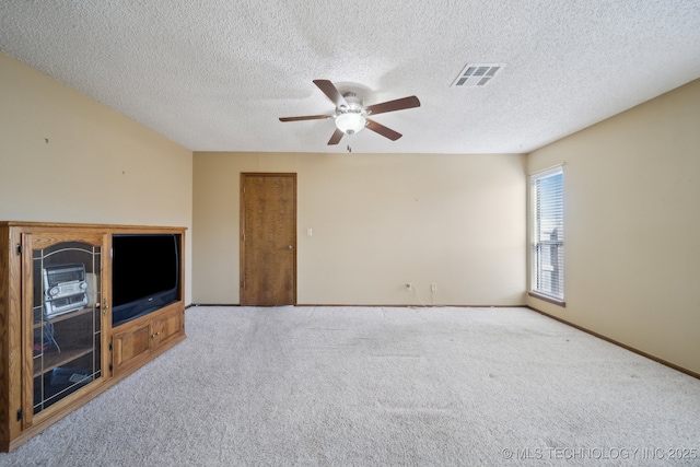 unfurnished living room featuring ceiling fan, light carpet, and a textured ceiling