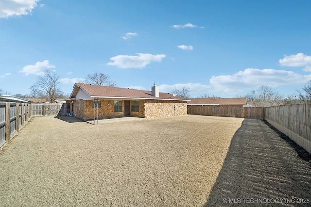 rear view of property featuring a patio area