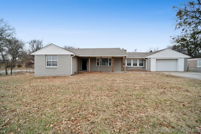 single story home with a garage and a front lawn