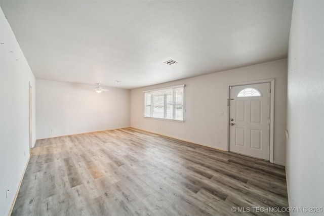 foyer entrance featuring ceiling fan and light hardwood / wood-style floors