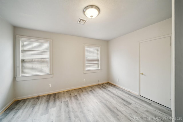 unfurnished room featuring light hardwood / wood-style flooring