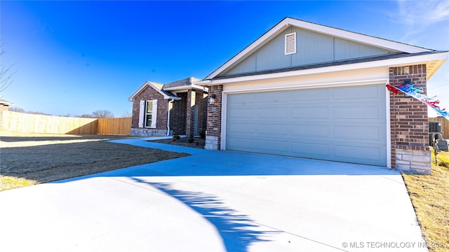 ranch-style home featuring a garage