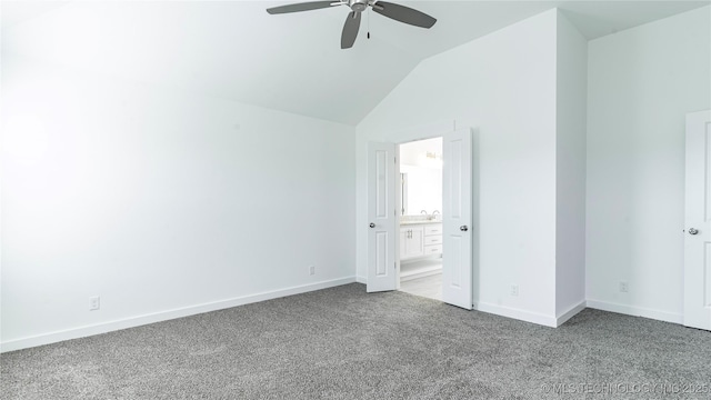 unfurnished bedroom with connected bathroom, sink, vaulted ceiling, light carpet, and ceiling fan