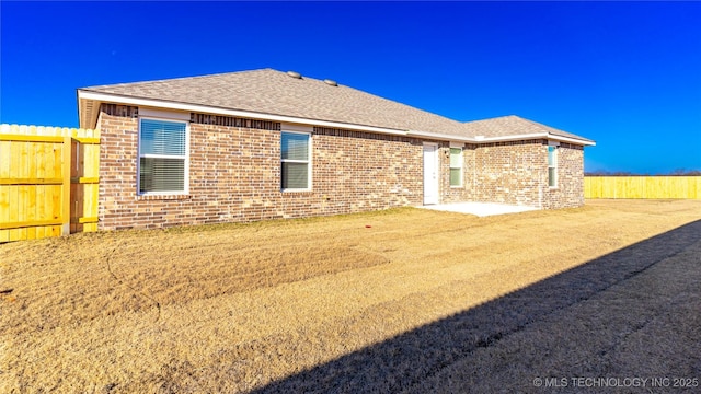 rear view of house featuring a patio