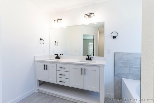 bathroom featuring vanity and a bathtub