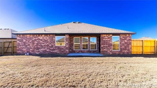 rear view of house with a patio