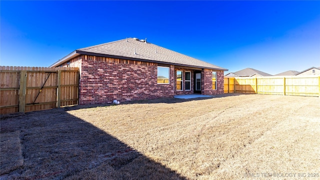 back of house featuring a patio area