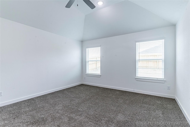 carpeted spare room featuring lofted ceiling and ceiling fan