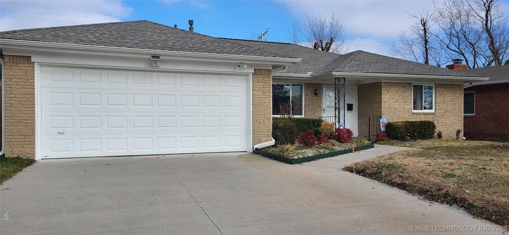 ranch-style home with a garage