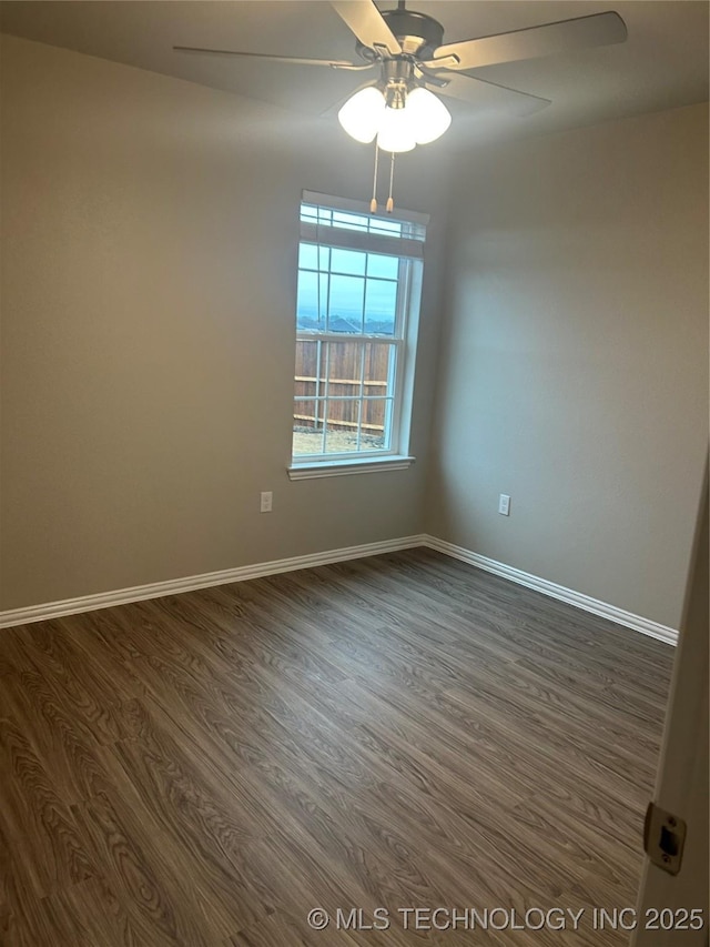 unfurnished room featuring dark hardwood / wood-style floors and ceiling fan