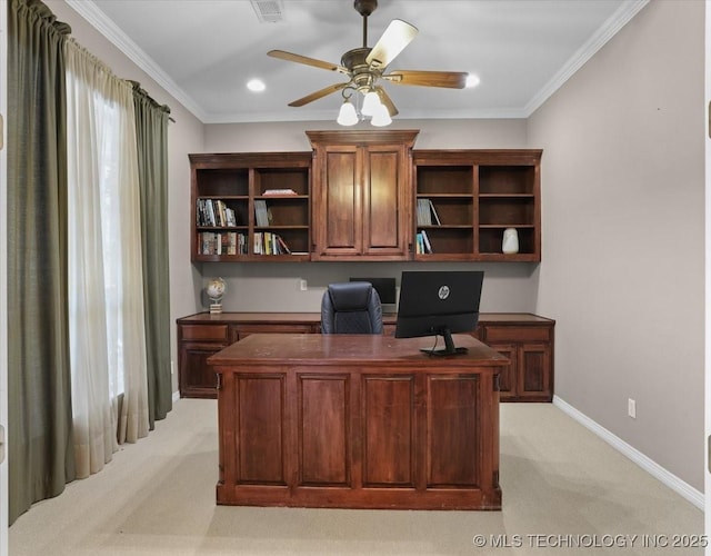 carpeted office featuring crown molding and ceiling fan