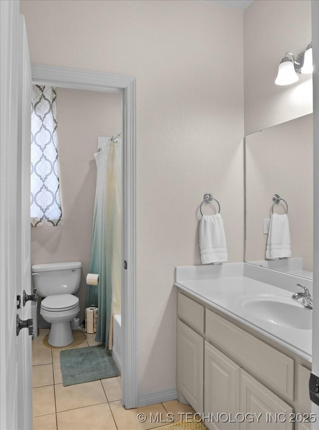 full bathroom featuring shower / tub combo with curtain, vanity, tile patterned flooring, and toilet