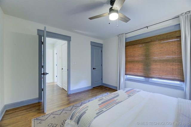 bedroom featuring hardwood / wood-style flooring and ceiling fan