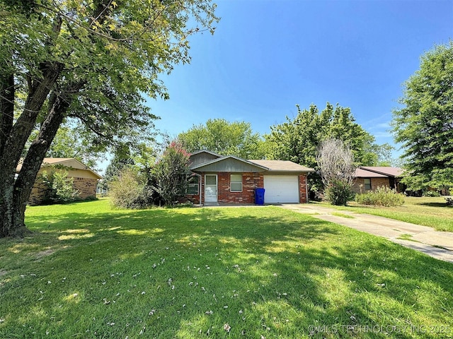 ranch-style house with a garage and a front lawn