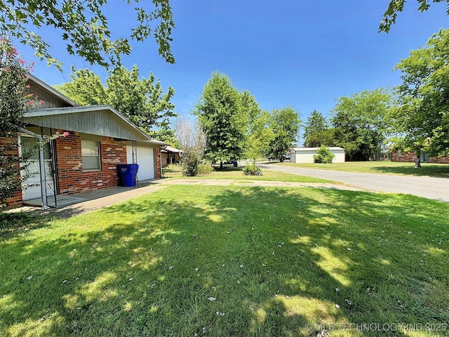 view of yard featuring a garage