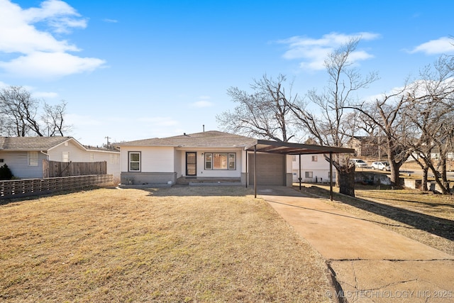 ranch-style home with a carport and a front yard