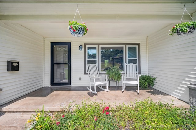 828 N Roosevelt Ave, Sand Springs, OK 74063 - view of exterior entry featuring a porch