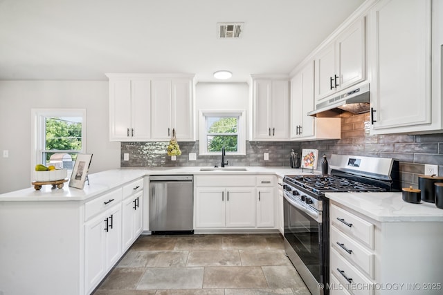 828 N Roosevelt Ave, Sand Springs, OK 74063 - kitchen featuring stainless steel appliances, under cabinet range hood, a sink, a peninsula, and plenty of natural light