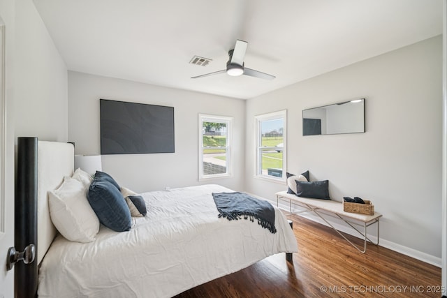 828 N Roosevelt Ave, Sand Springs, OK 74063 - bedroom with baseboards, wood finished floors, and ceiling fan