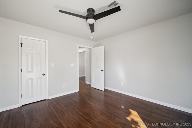 unfurnished bedroom featuring dark wood-type flooring and ceiling fan