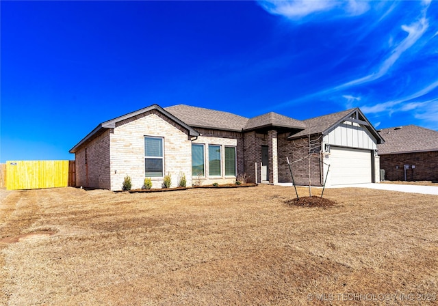 ranch-style home featuring concrete driveway, roof with shingles, an attached garage, fence, and brick siding