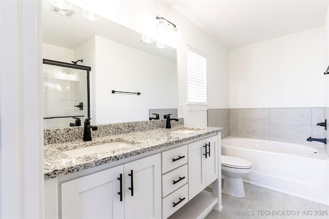 bathroom featuring tile patterned flooring, visible vents, a sink, and a bath